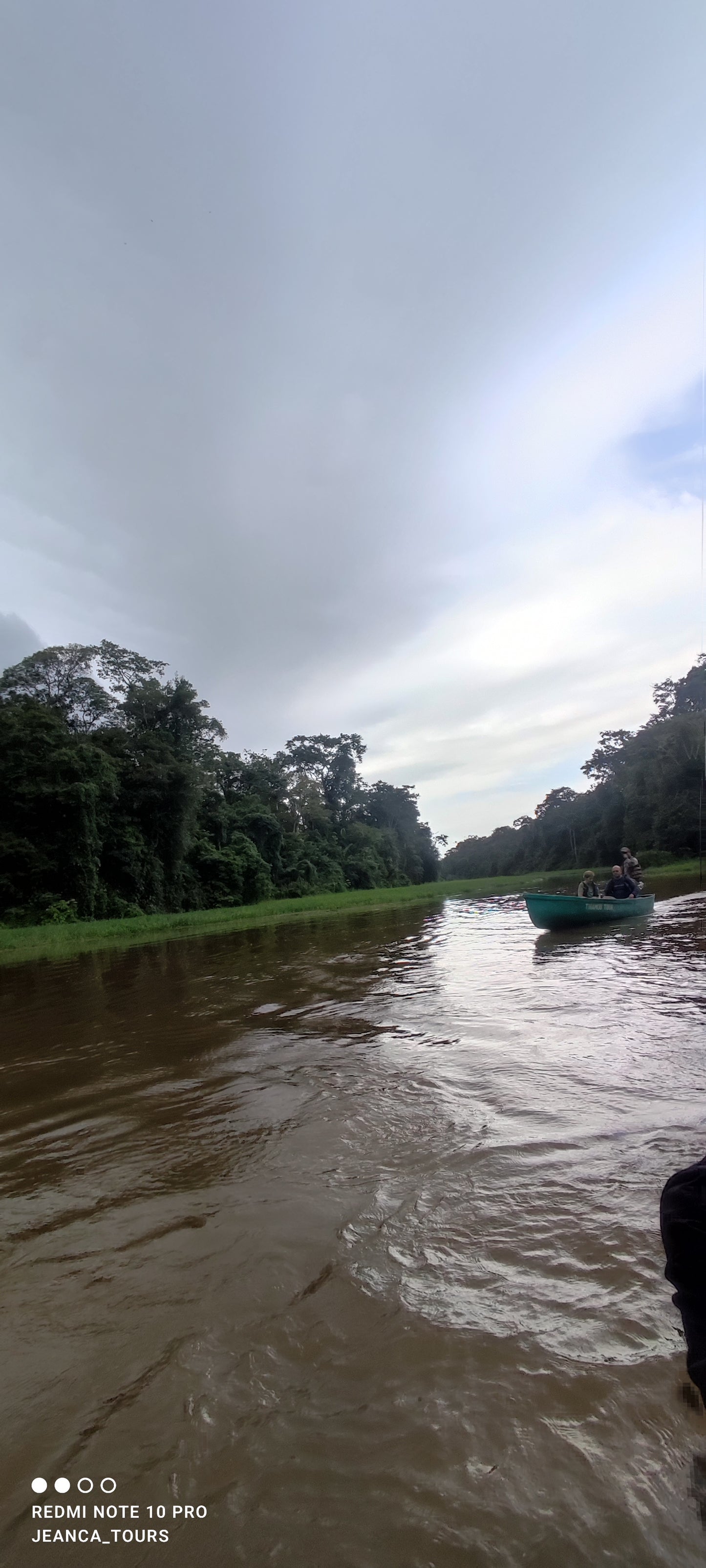 Scenic canoe tour through Tortuguero National Park showcasing rich wildlife and lush tropical landscapes.